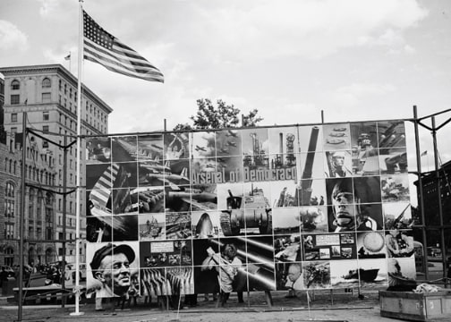 Photo: “Four Freedoms and Arsenal of Democracy” poster displayed in Defense Square, Washington, D.C., for a month beginning 7 November 1941. Credit: Library of Congress, Prints and Photographs Division.