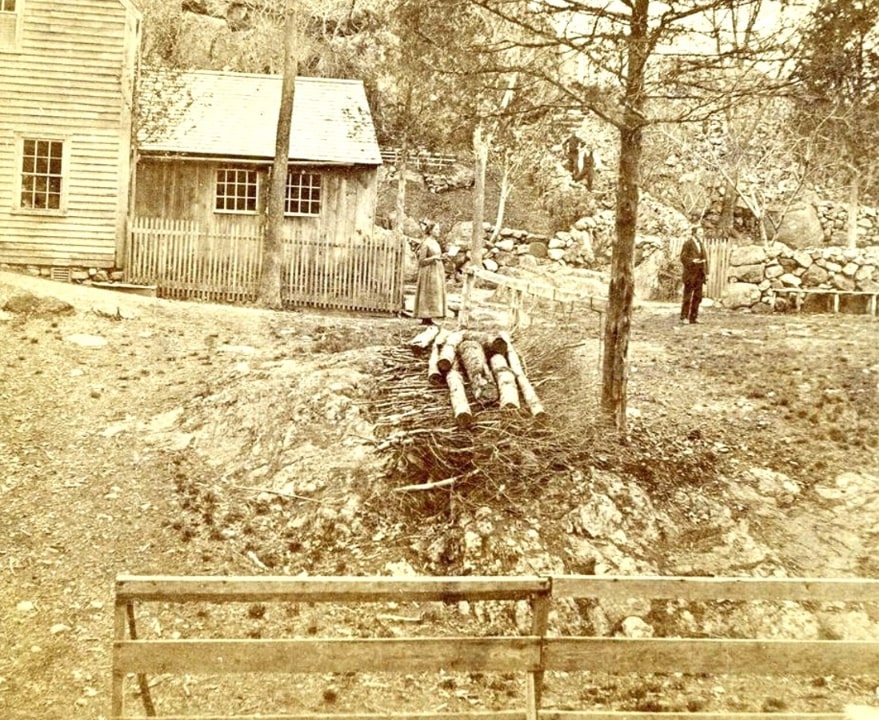 Photo: Hiram and Arminda Marble standing outside their home in Lynn, Massachusetts, located next to “Dungeon Rock.” Courtesy of Lynn Historical Association.