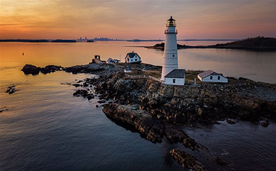 Photo: Boston Light at sunset. Credit: Greg Sager.