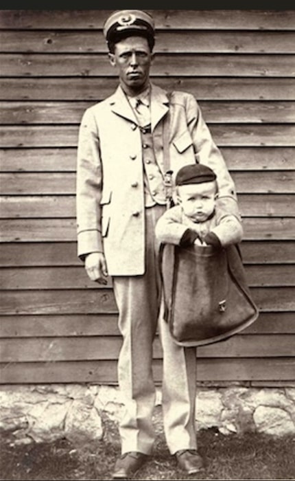 Photo: a baby in a letter carrier’s mailbag. Credit: Smithsonian National Postal Museum.