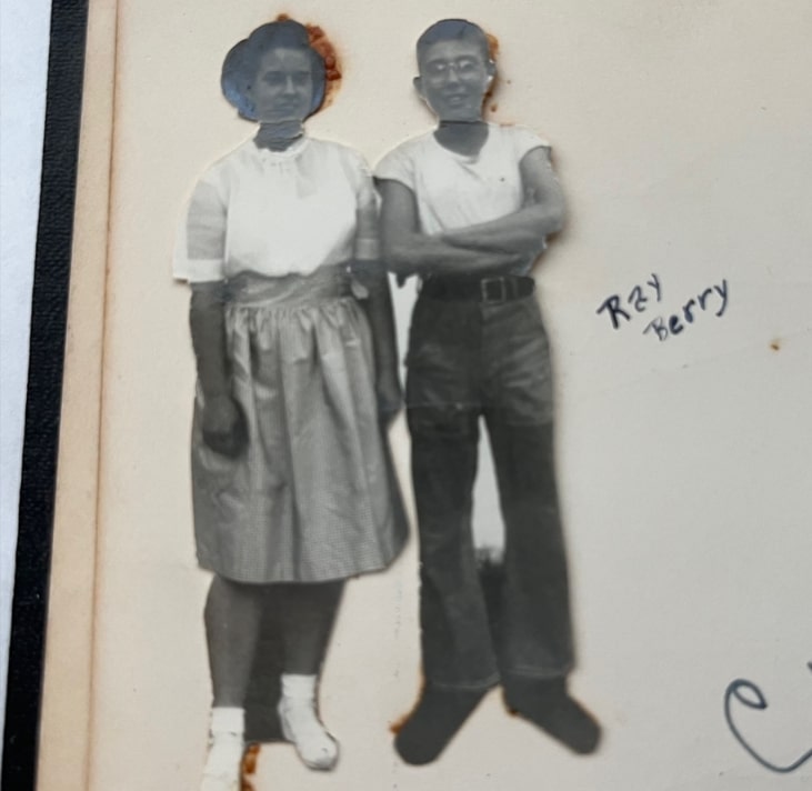 Photo: close-up of Marjorie (?) and Raymond in school memory book. Credit: Gena Philibert-Ortega.