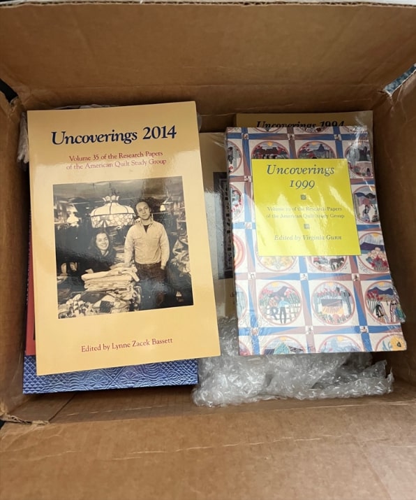 Photo: box of “Uncoverings” journals. Credit: Gena Philibert-Ortega.