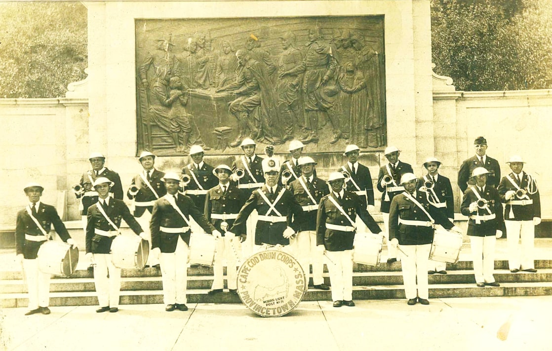 Photo: Cape Cod Drum Corps, Morris Light Post No. 71, Memorial Day 1947, standing at the base of the Pilgrim Monument in Provincetown, Massachusetts. Credit: Provincetown Historic Project.